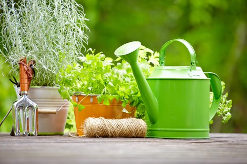 Landscape gardening in Old Ford with a stylish urban patio and planting